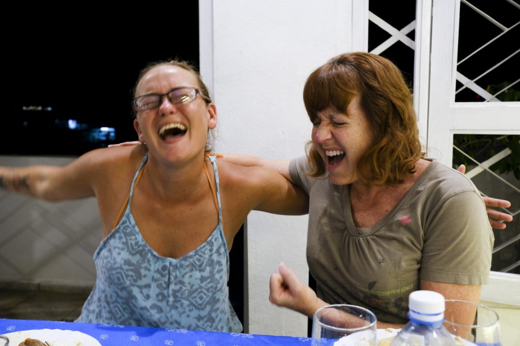 women laughing in Cuba