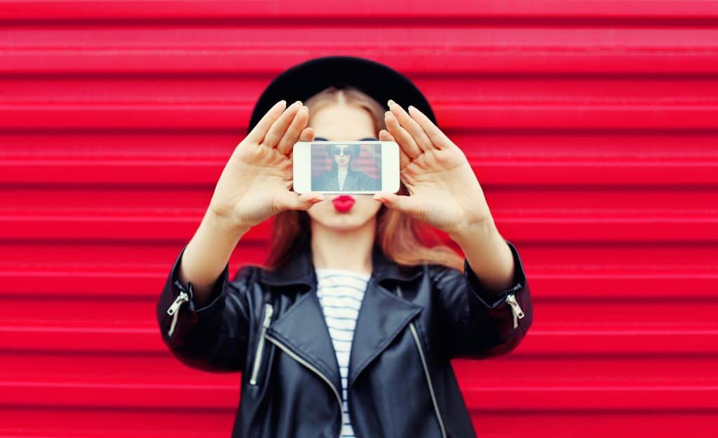 woman taking a selfie for IG