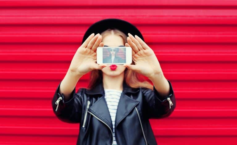 woman taking a selfie for IG