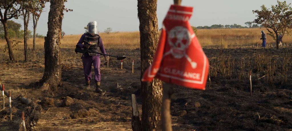 woman demining in Angola