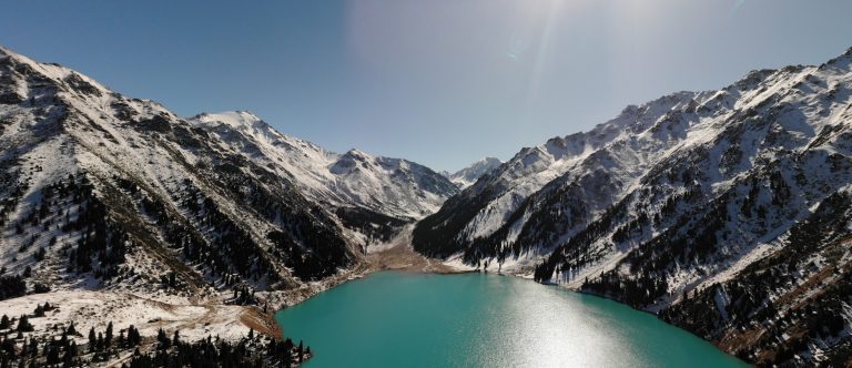 Google Street Map view of mountains with ice and a water body