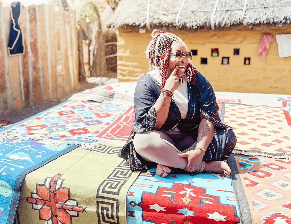 woman solo traveler sitting on carpets in India