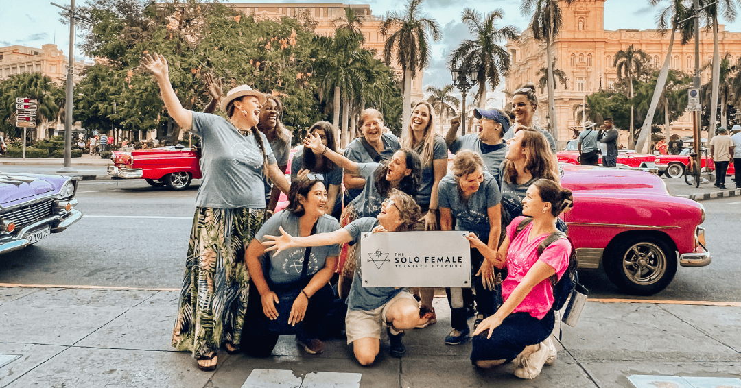 solo female travelers on tour in Havana, Cuba posing for a tour group photo