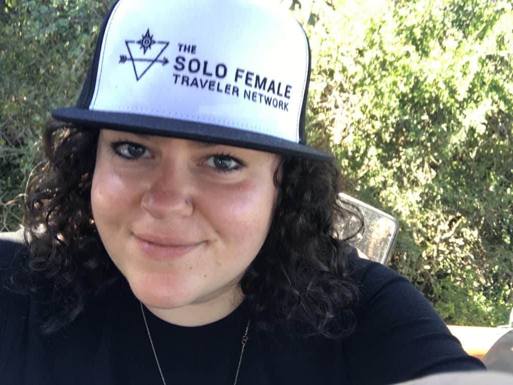 woman with solo female traveler hat