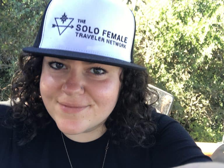 woman with solo female traveler hat