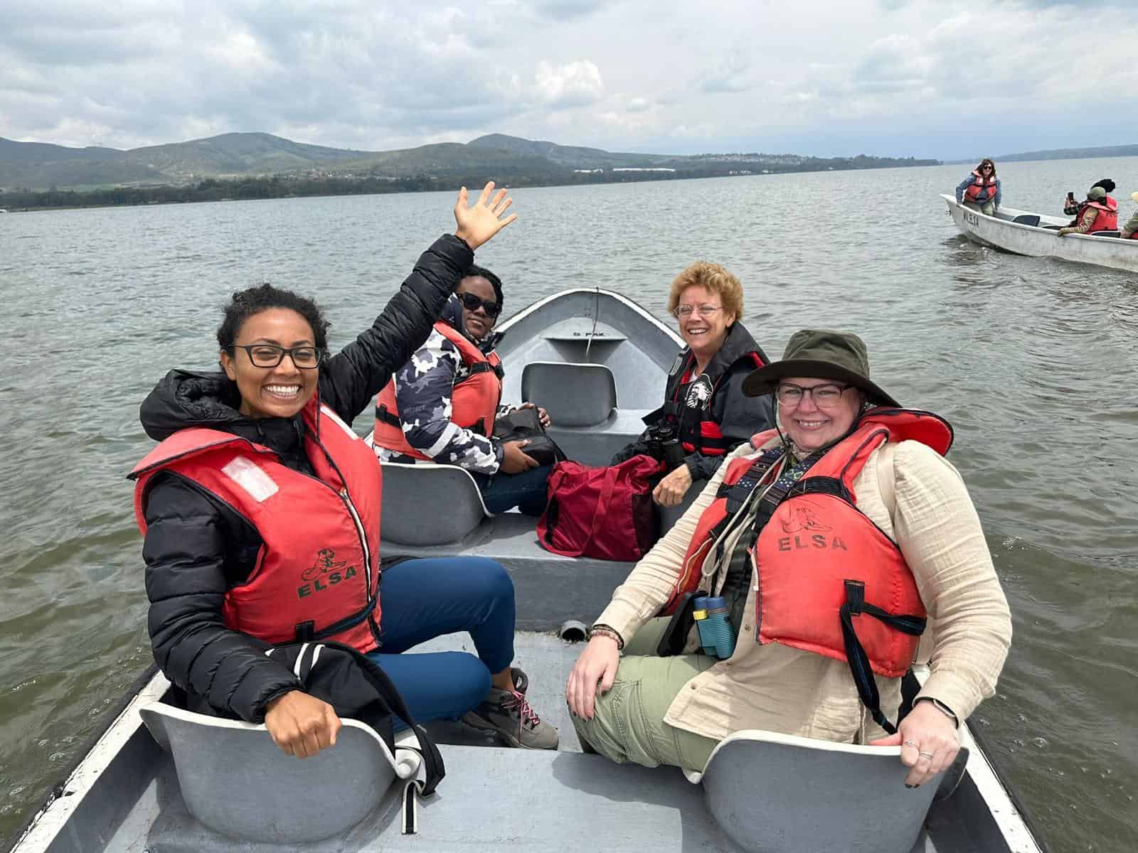 solo female travelers in Kenya on a women only tour riding a boat