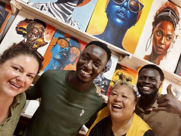This is the Solo Female Traveler Network team with artists in Uganda.
