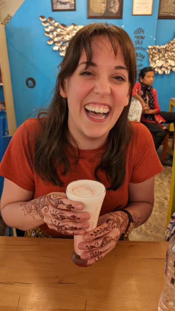Dana with henna and a lassi on a women-only India tour