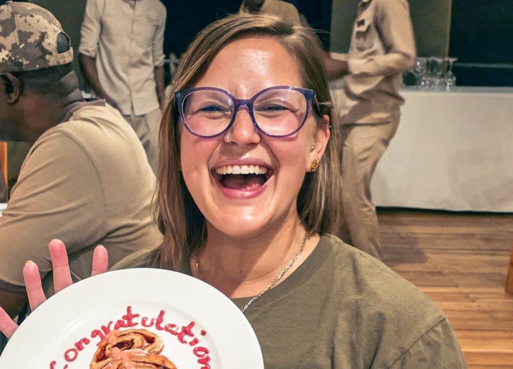 Chelsea Hottovy laughing as she celebrates her seventh continent in Tanzania