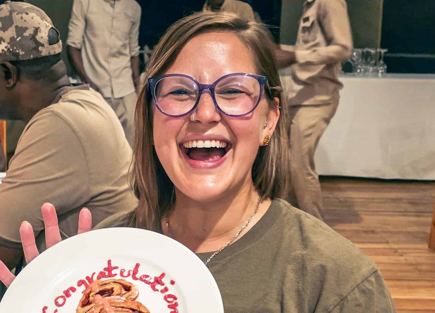 Chelsea Hottovy laughing as she celebrates her seventh continent in Tanzania
