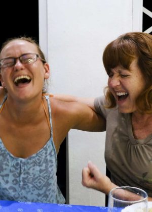 women laughing in Cuba