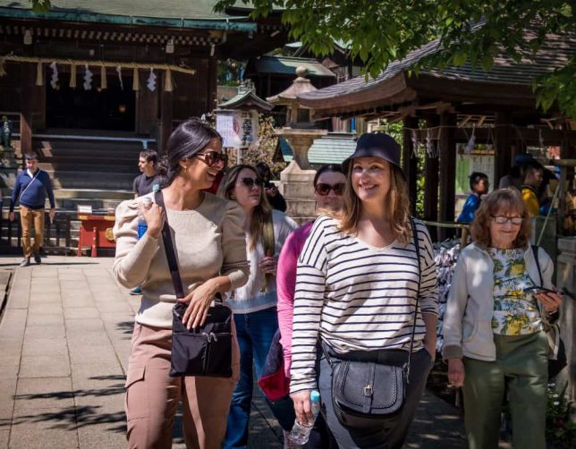 JapanGroupSoFeBestTimeToVisitAsia Japan tour for women walking through streets