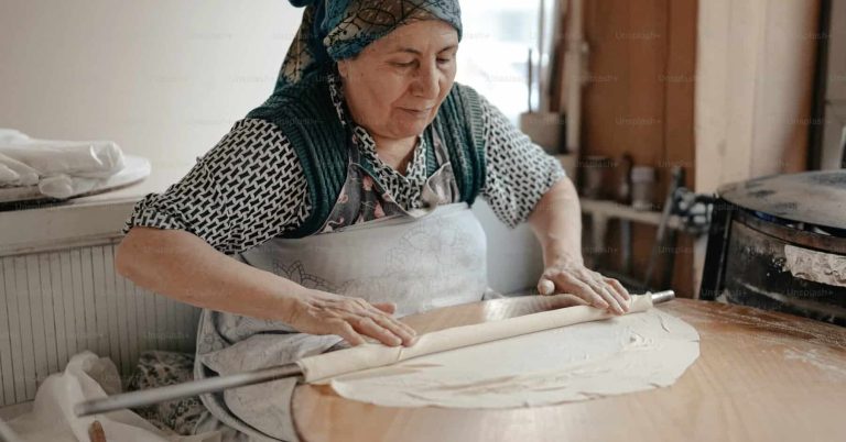 Women-Focused Tour to Uzbekistan. Women Rolling Dough.