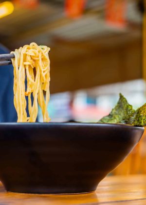 Woman,Eating,A,Spicy,Ramen,Japanese,Noodle,Soup,In,A